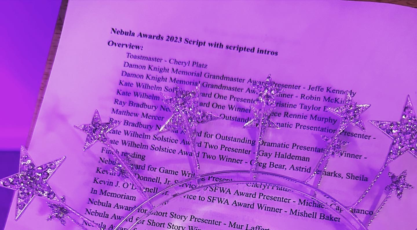 An image of Cheryl's Nebula Awards tiara on top of the run script.