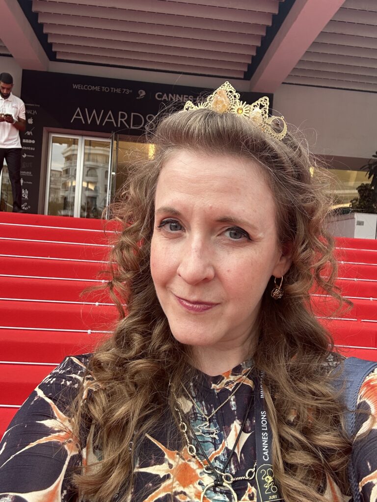 Cheryl poses in a selfie on the Red Carpet stairs headed to the Awards Show. 