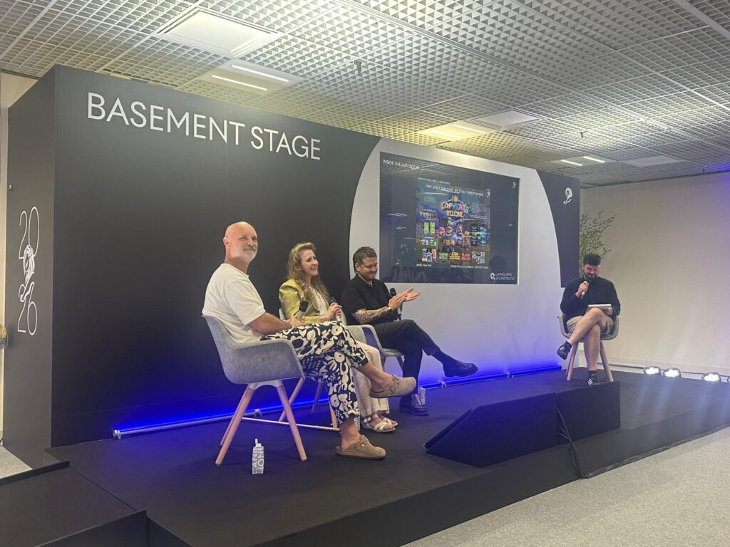Cheryl sits with two other jurors on the Basement Stage at Cannes Lions, describing several of the winners to the audience during a panel. 